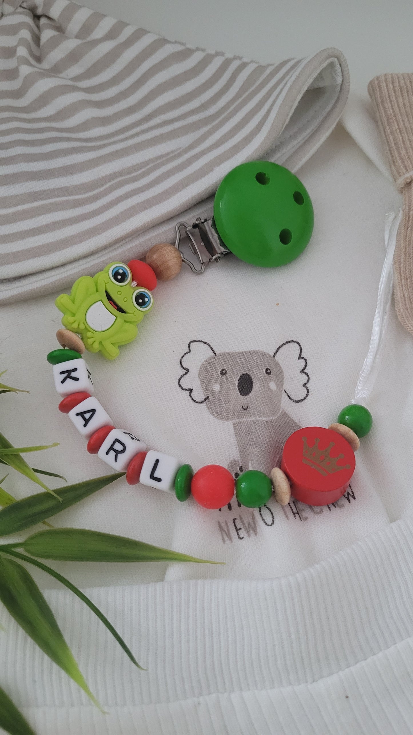 Schnullerkette Frosch Prinz grün rot