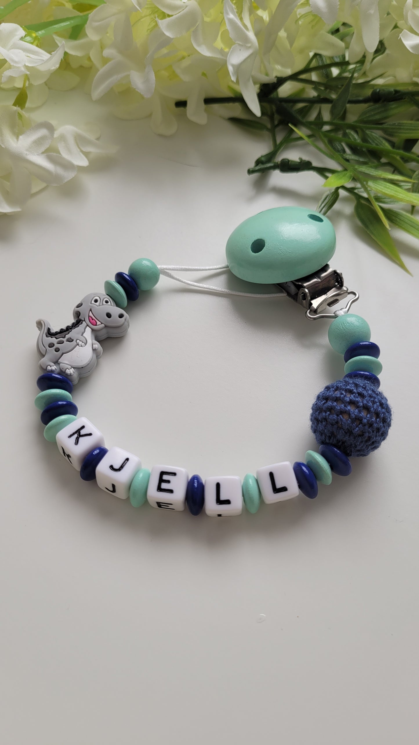 Schnullerkette mit Namen für Jungen Dino mint blau