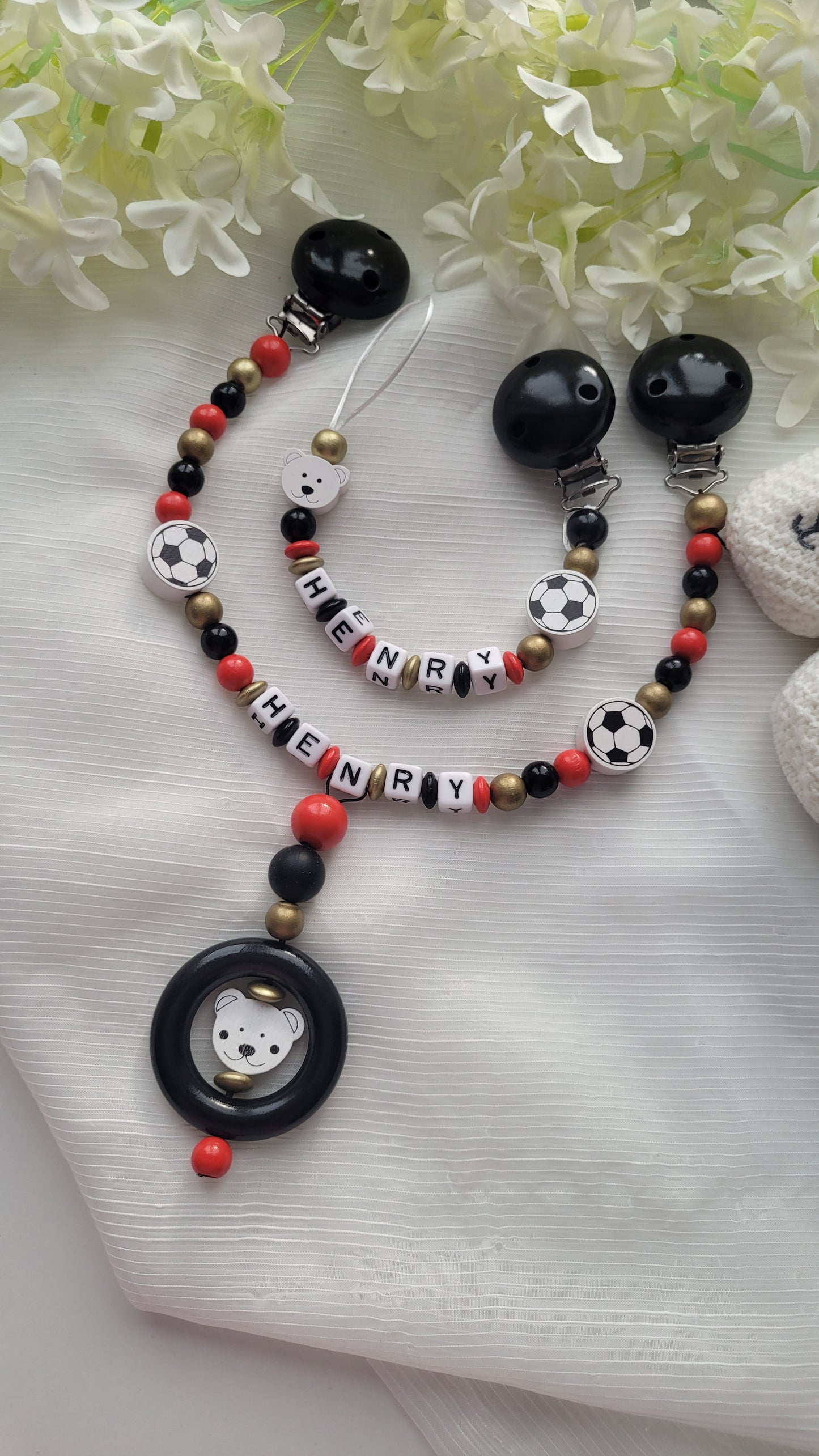 Kinderwagenkette & Schnullerkette mit Namen Fussball schwarz rot gold
