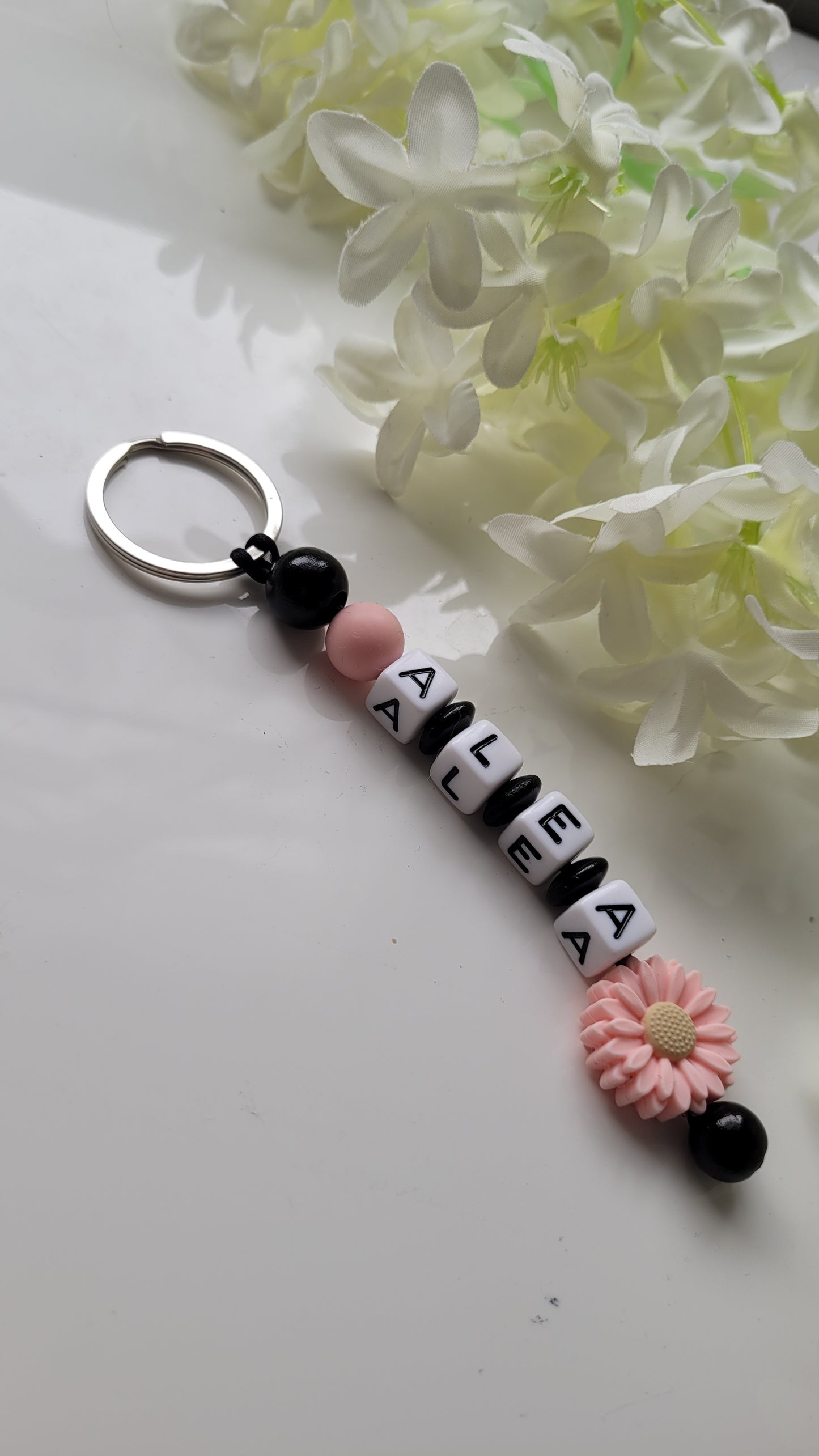 Schlüsselanhänger mit Namen schwarz peach Motivauswahl