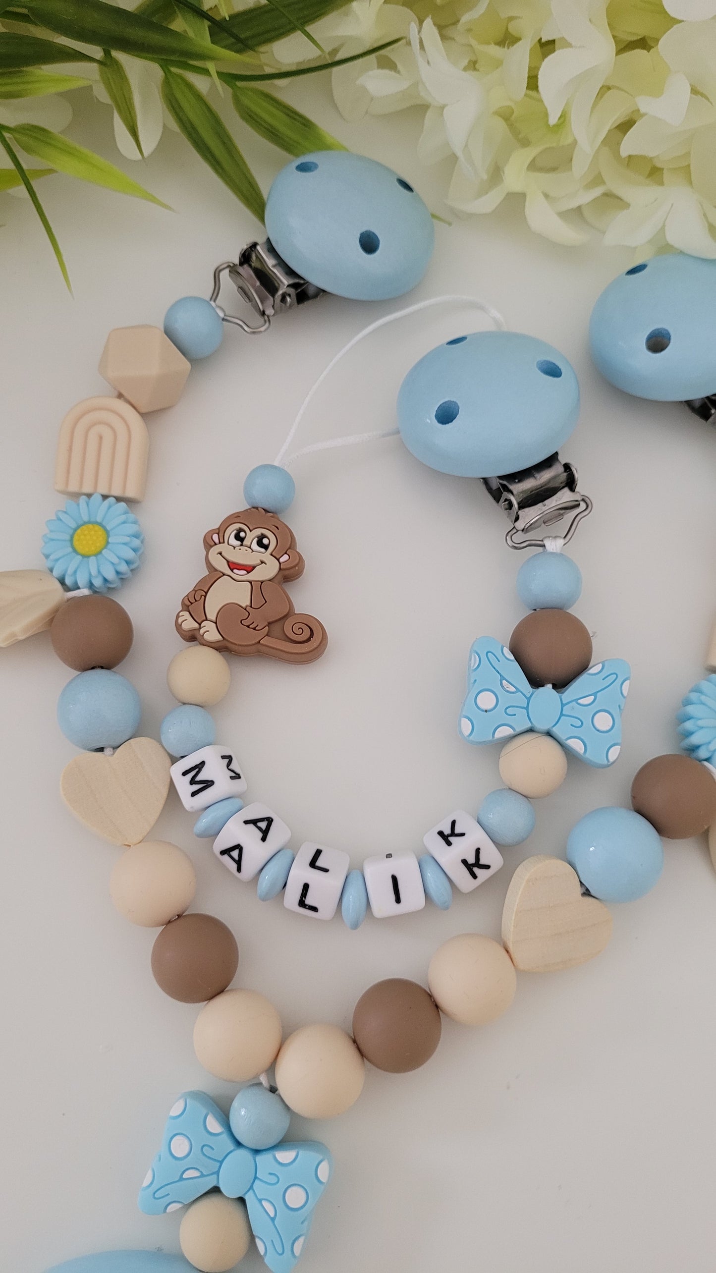 Kinderwagenkette & Schnullerkette *Äffchen* hellblau beige