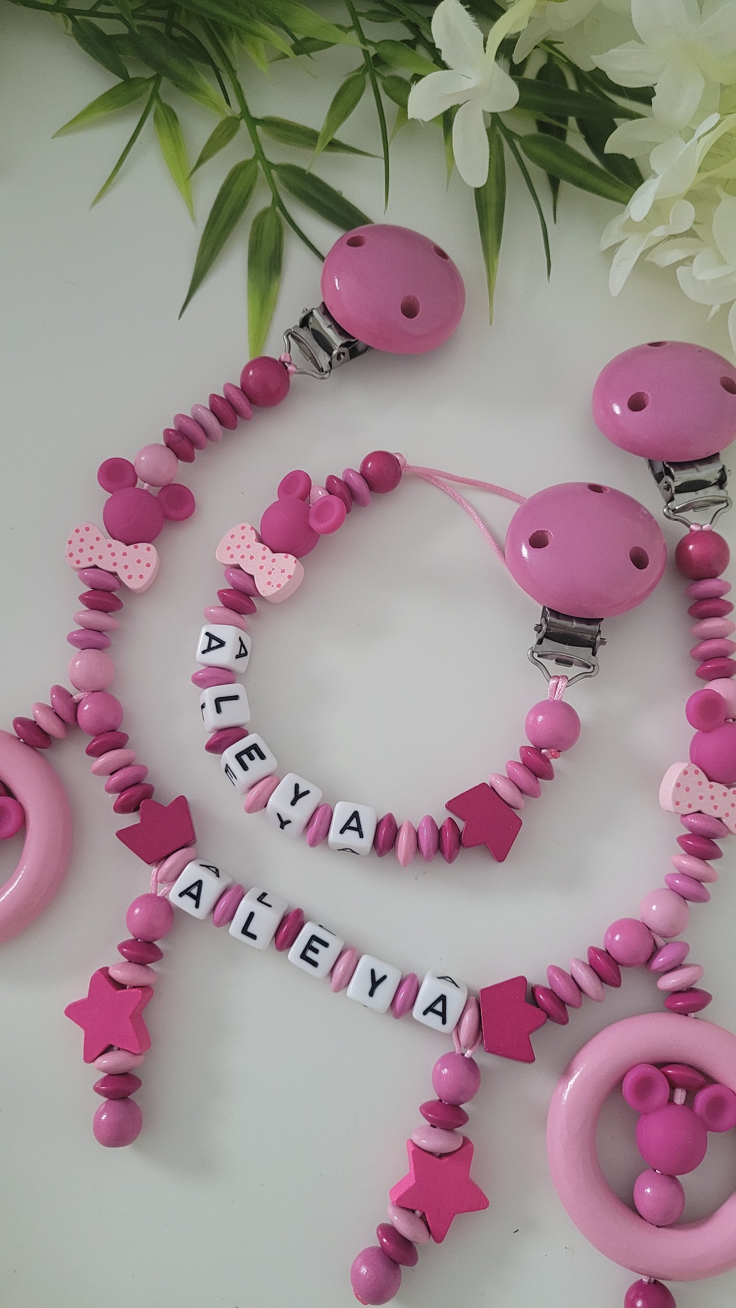 Kinderwagenkette & Schnullerkette pink Minnie Maus Spielringe