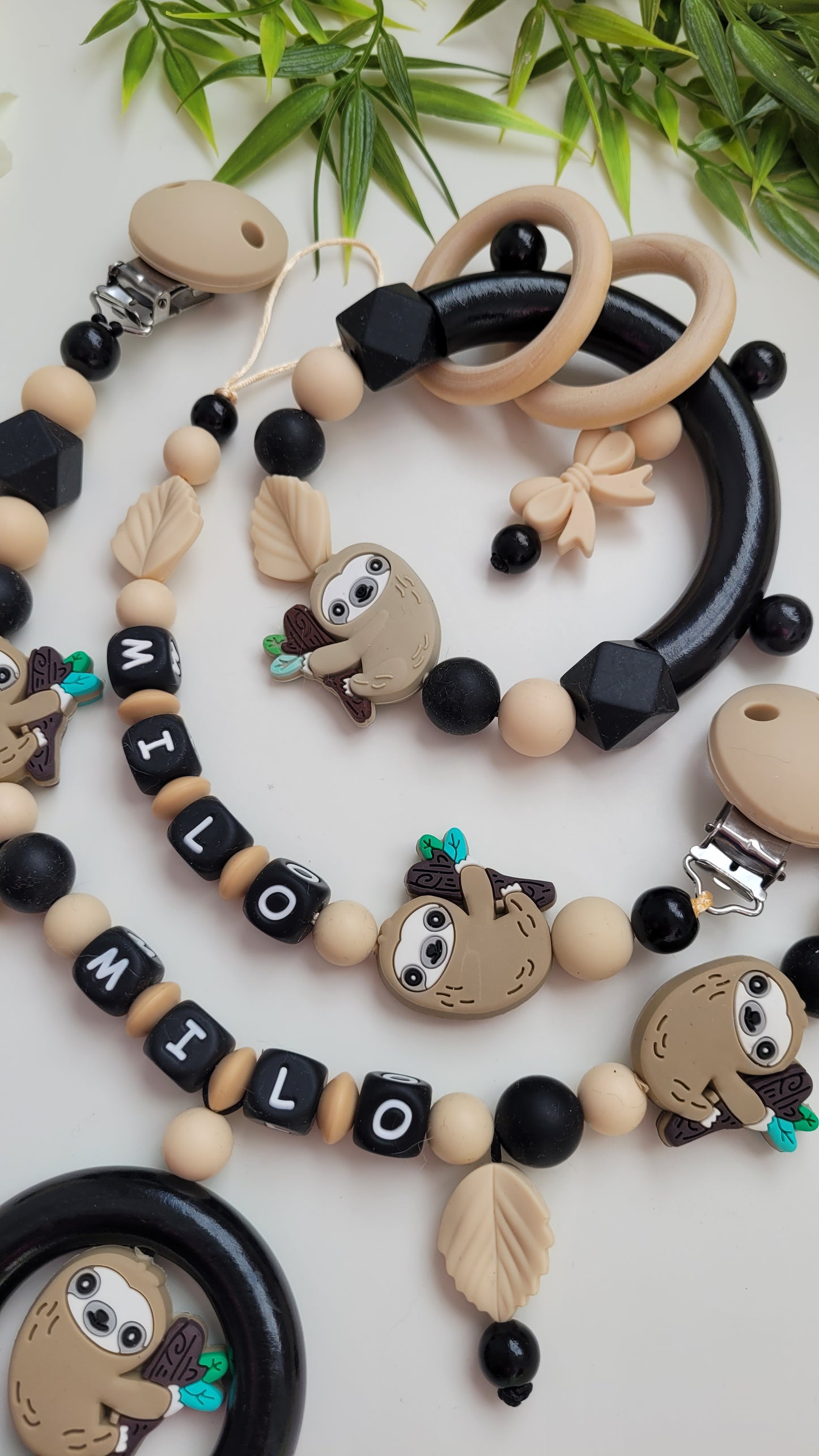 3tlg Set Schnullerkette Kinderwagenkette Greifling Faultier schwarz beige