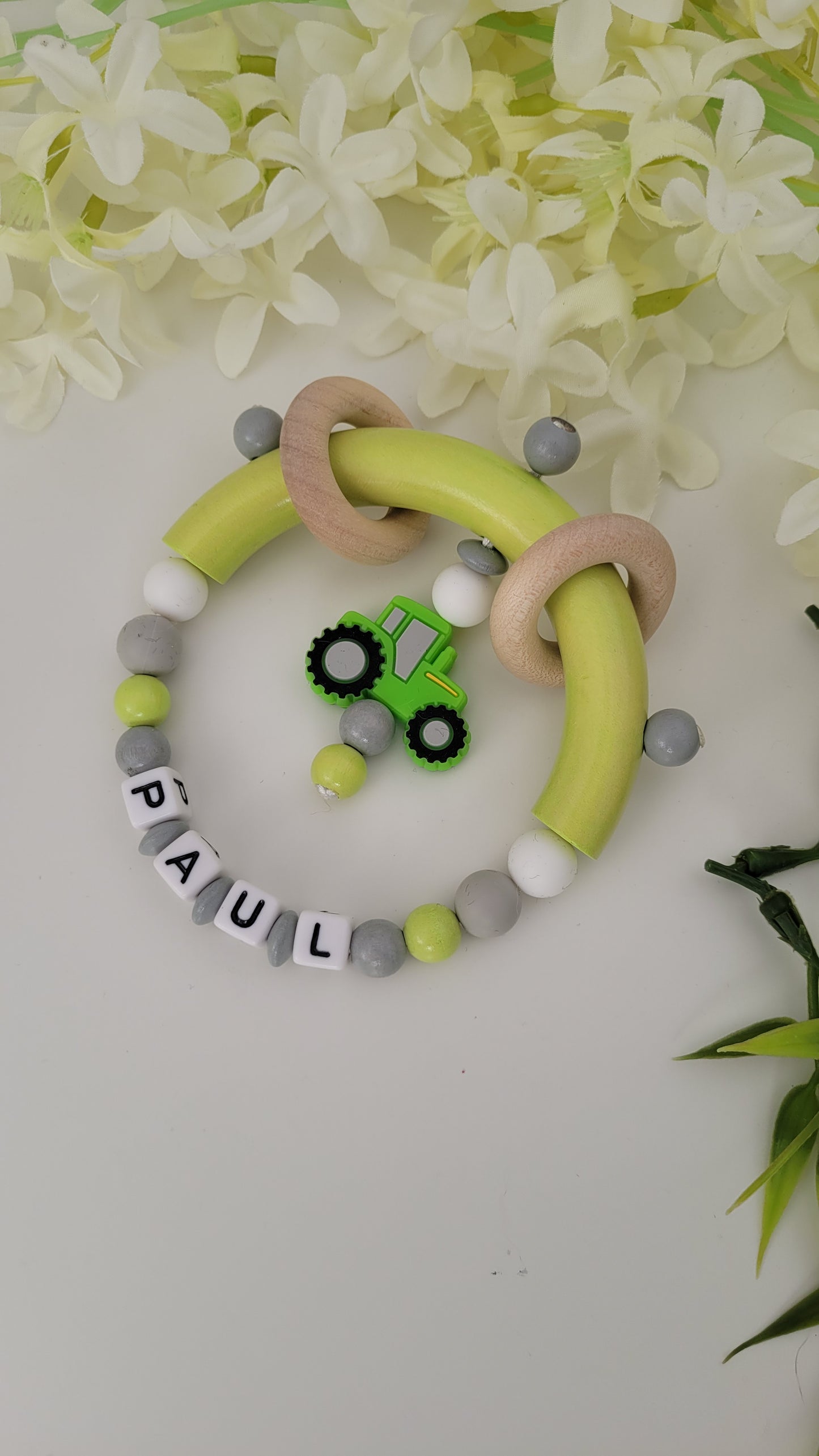 Motorik Greifring mit Namen Traktor grün
