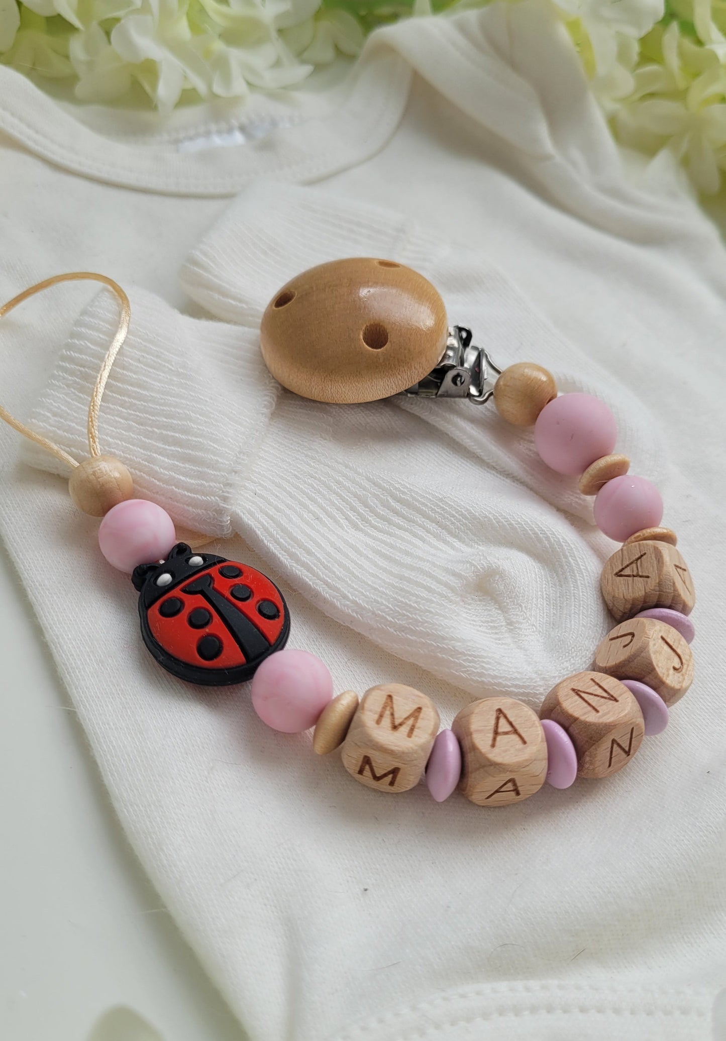 Schnullerkette mit Namen für Mädchen Marienkäfer rosa holz
