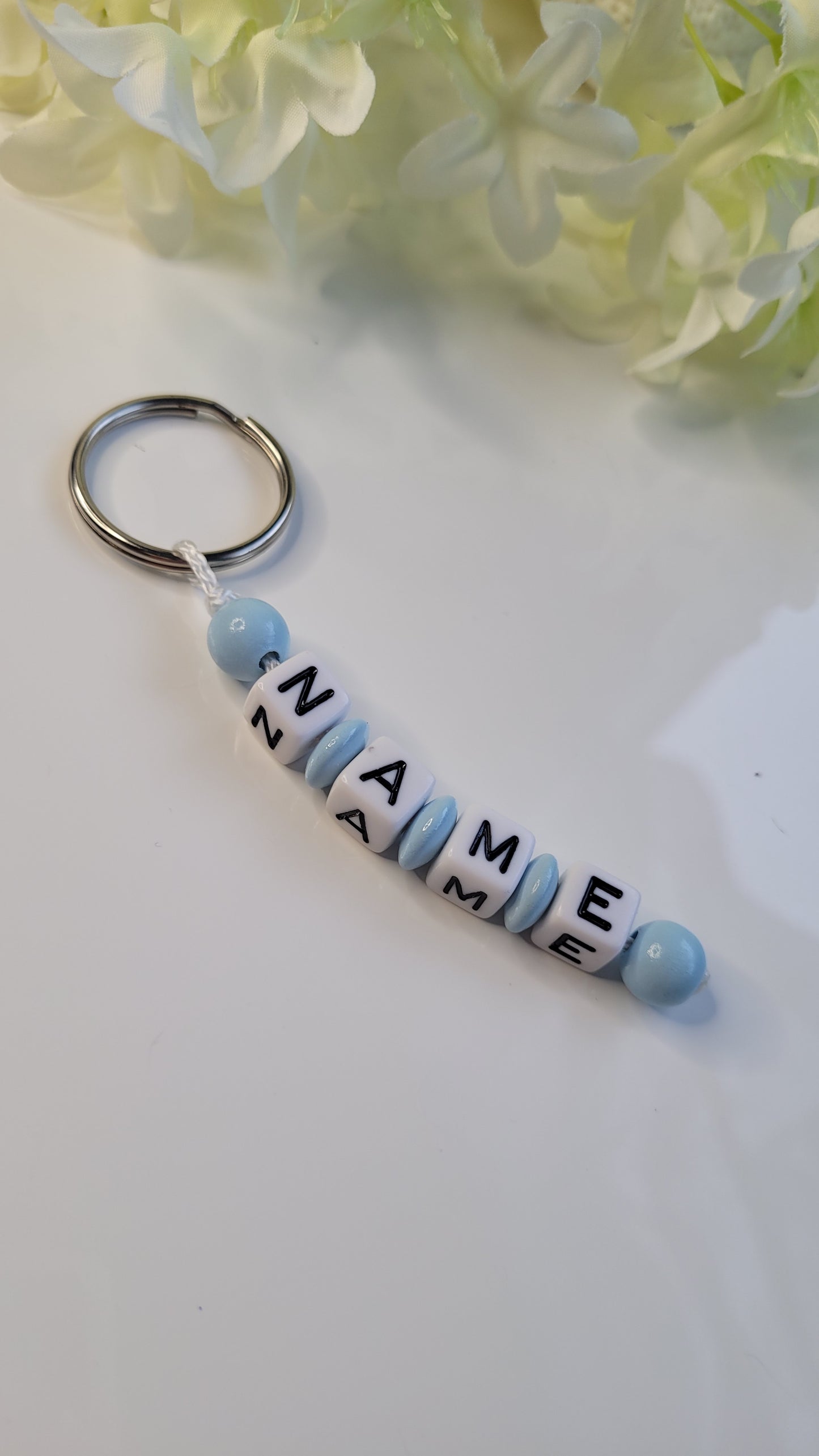 Schlüsselanhänger mit Namen hellblau