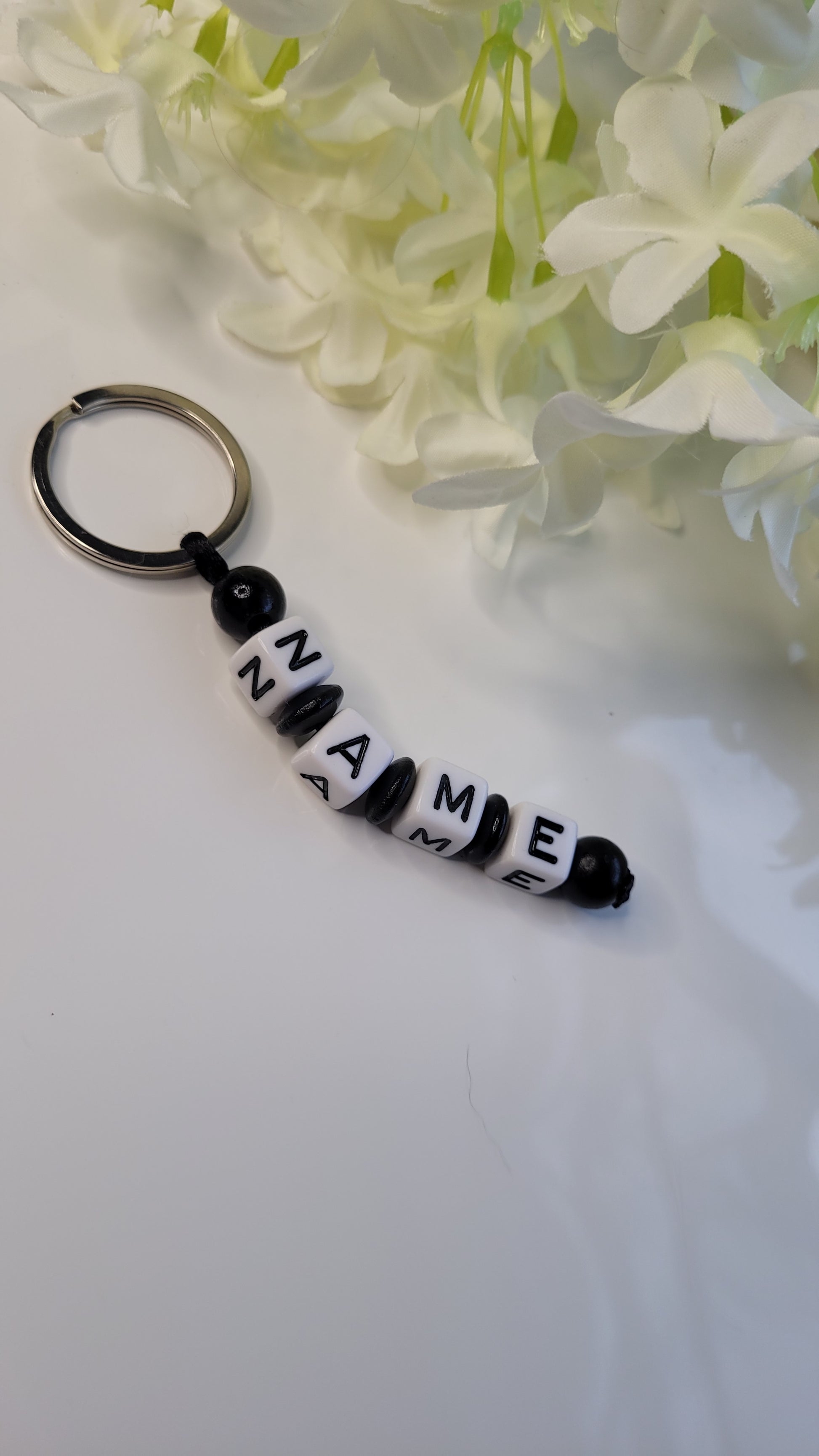 Schlüsselanhänger Holzperlen schwarz personalisiert name
