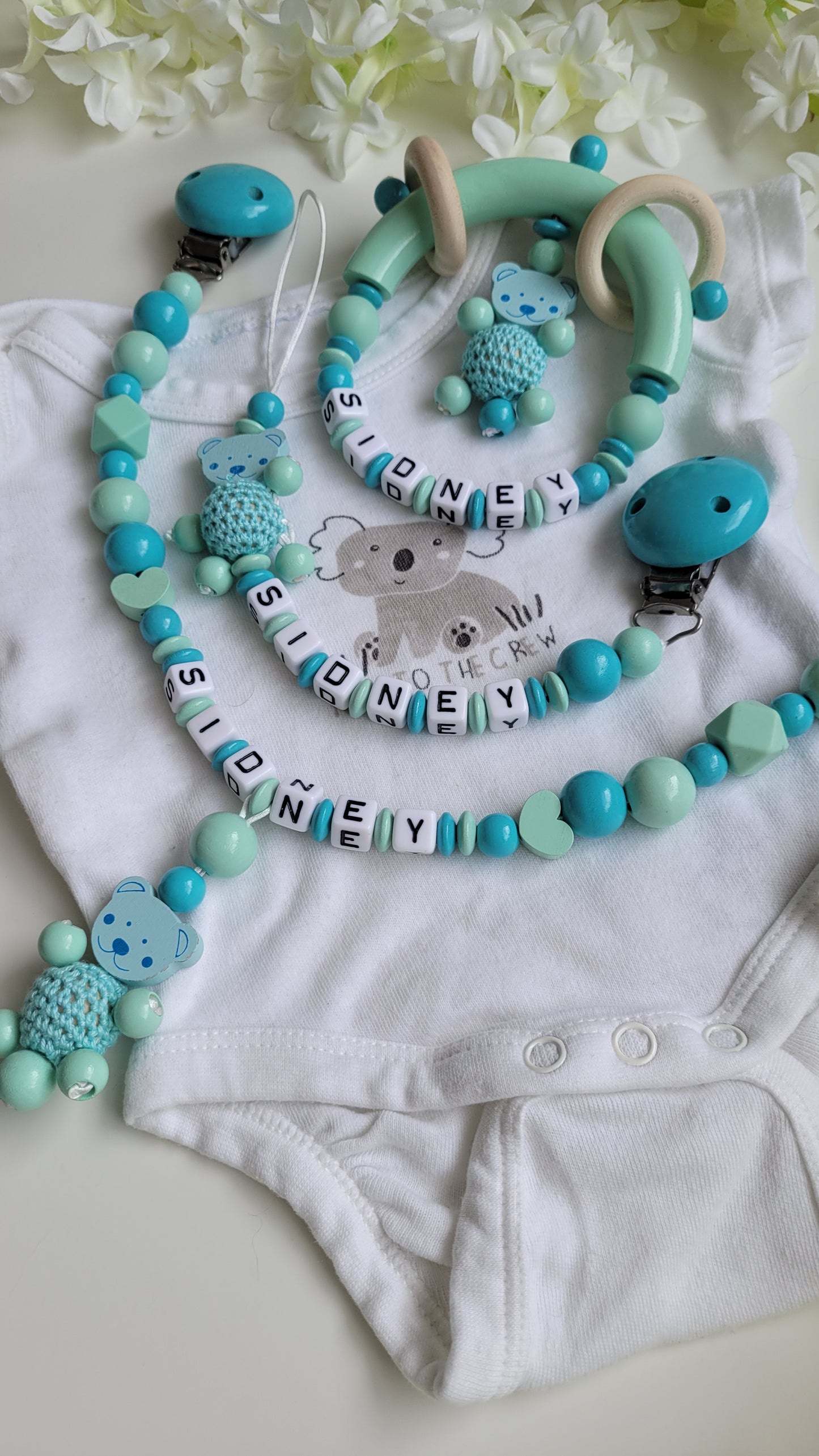 3tlg.Set Schnullerkette Kinderwagenkette & Greifring Teddy türkis