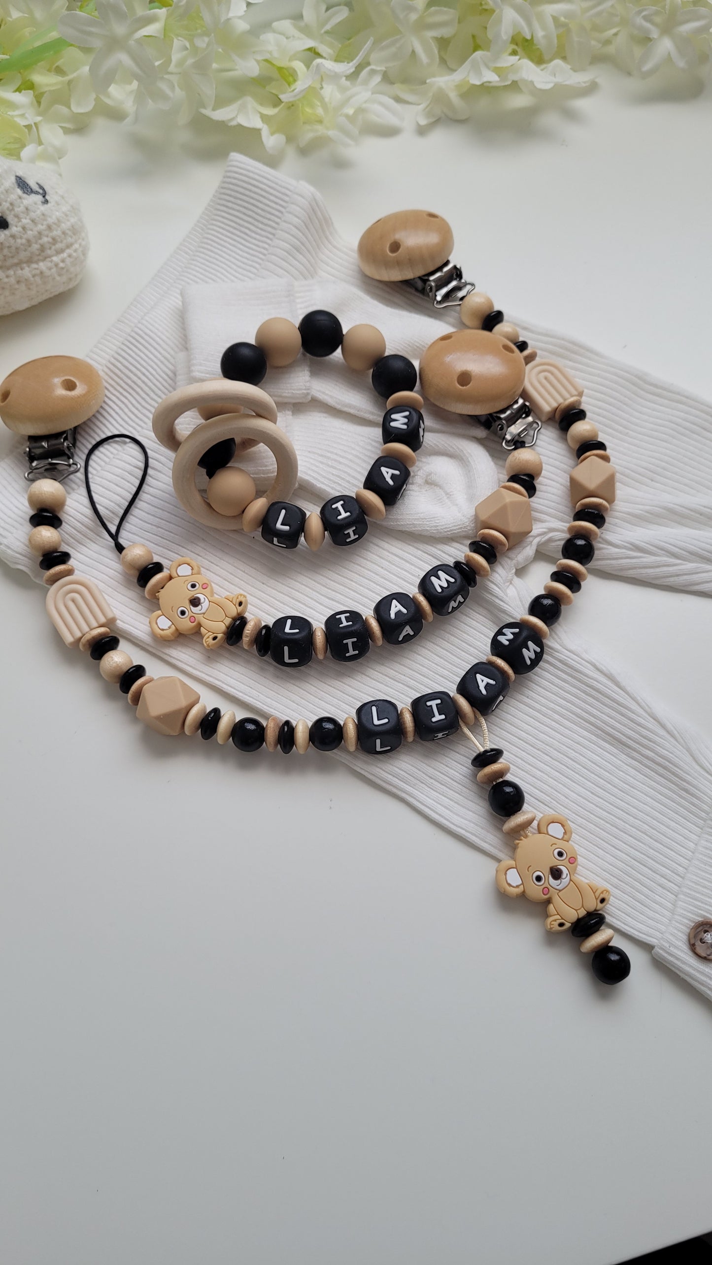 3 tlg Set Schnullerkette Kinderwagenkette Greifring Koalabärchen  Schwarz beige