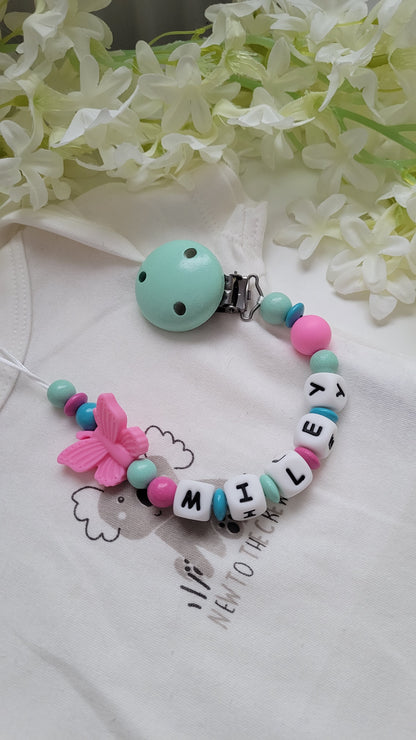 Schnullerkette mit Namen Schmetterling türkis pink