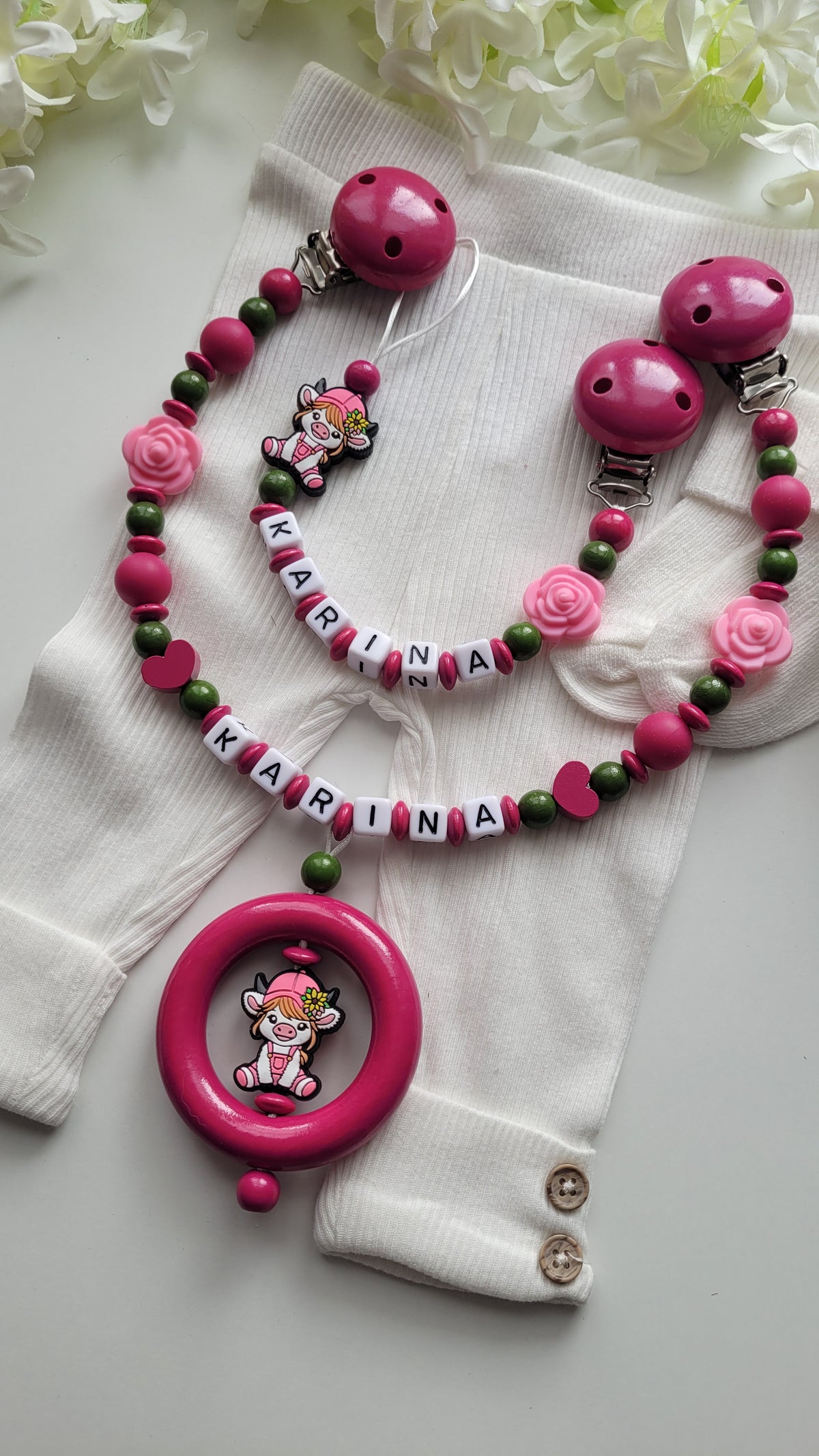 Kinderwagenkette & Schnullerkette mit Namen Kuh pink grün