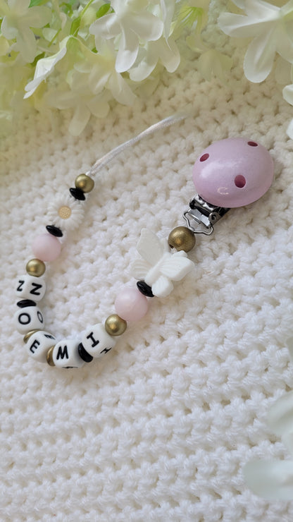 Schnullerkette mit Namen für Mädchen Schmetterling rosa schwarz gold