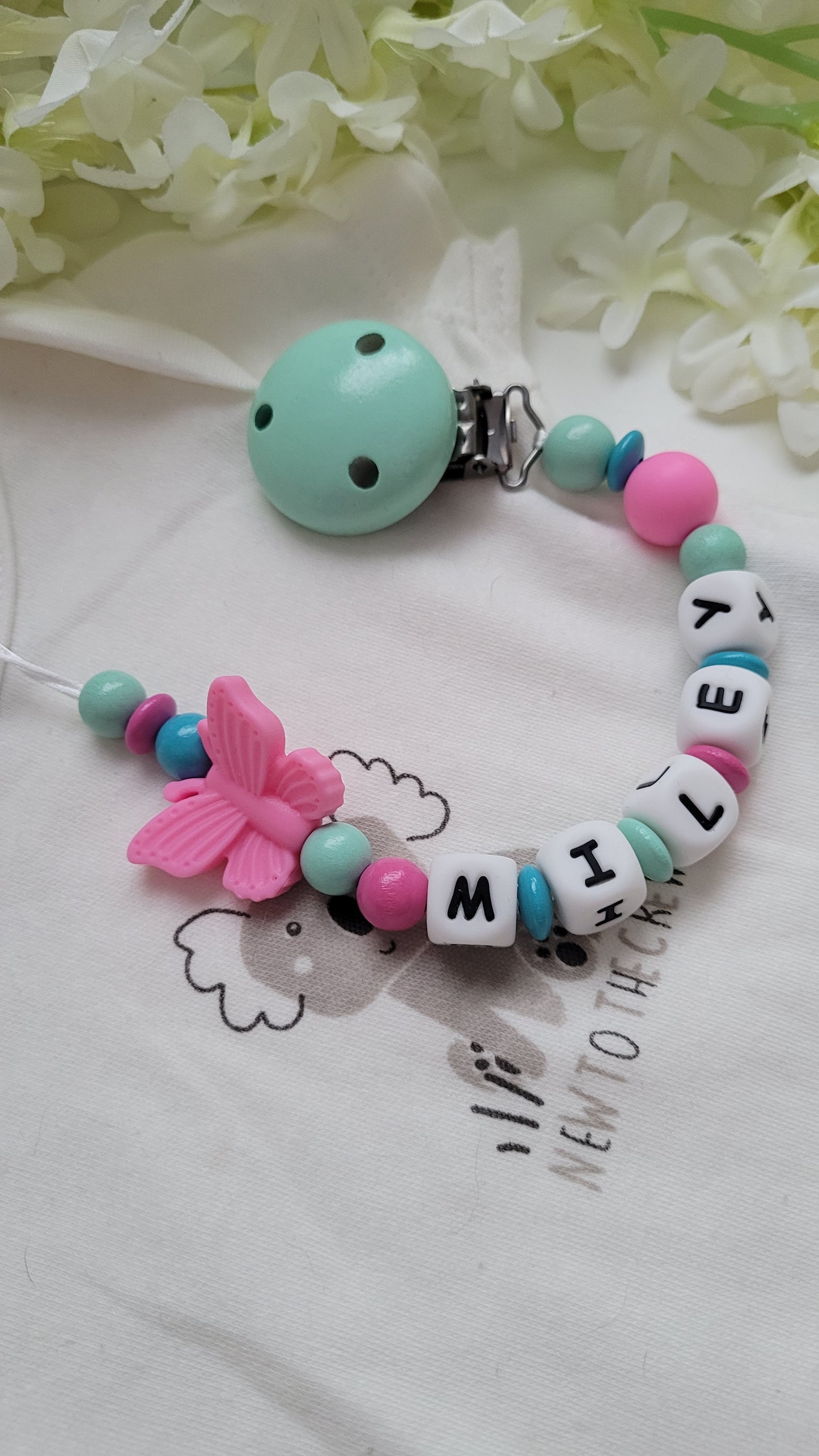 Schnullerkette mit Namen Schmetterling türkis pink