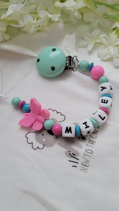 Schnullerkette mit Namen Schmetterling türkis pink