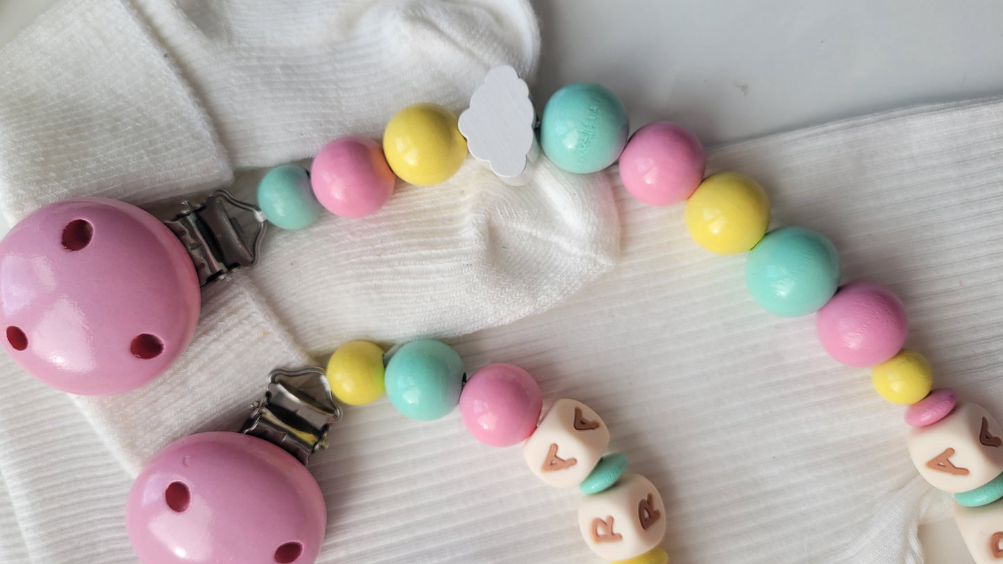 3er Set Schnullerkette, Kinderwagenkette & Greifring Regenbogen Pastellfarben