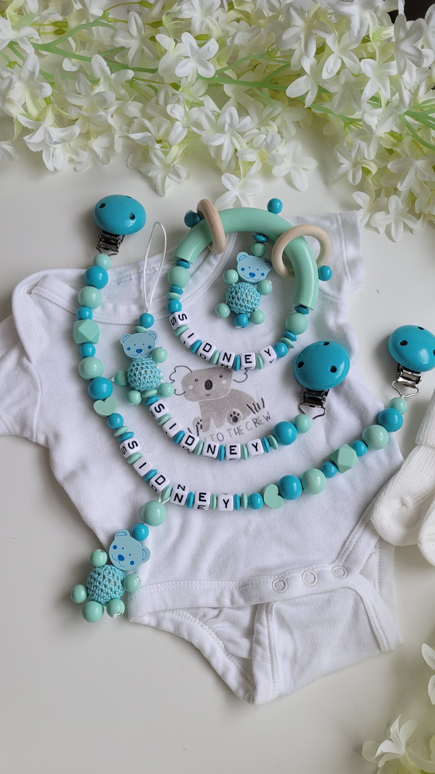 3tlg.Set Schnullerkette Kinderwagenkette & Greifring Teddy türkis