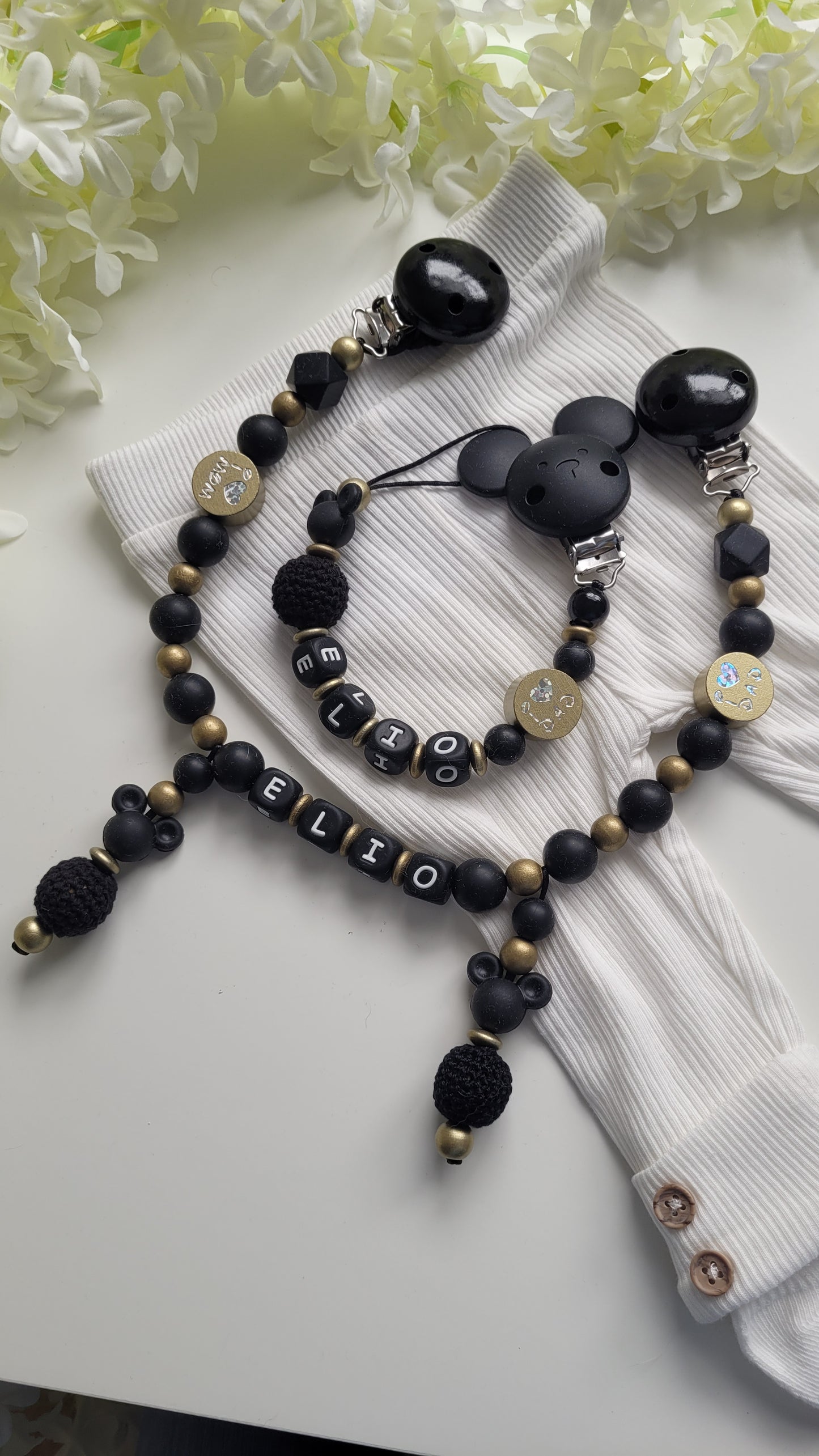 Kinderwagenkette & Schnullerkette mit Namen schwarz gold
