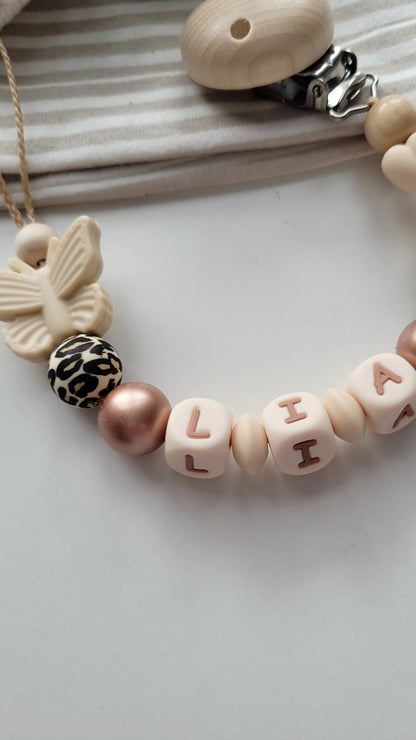 Schnullerkette mit Namen für Mädchen Schmetterling & Schleife leo beige rosegold