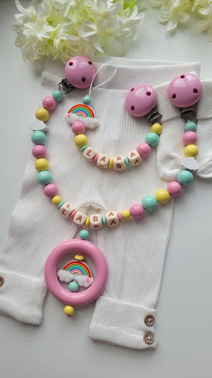 3er Set Schnullerkette, Kinderwagenkette & Greifring Regenbogen Pastellfarben