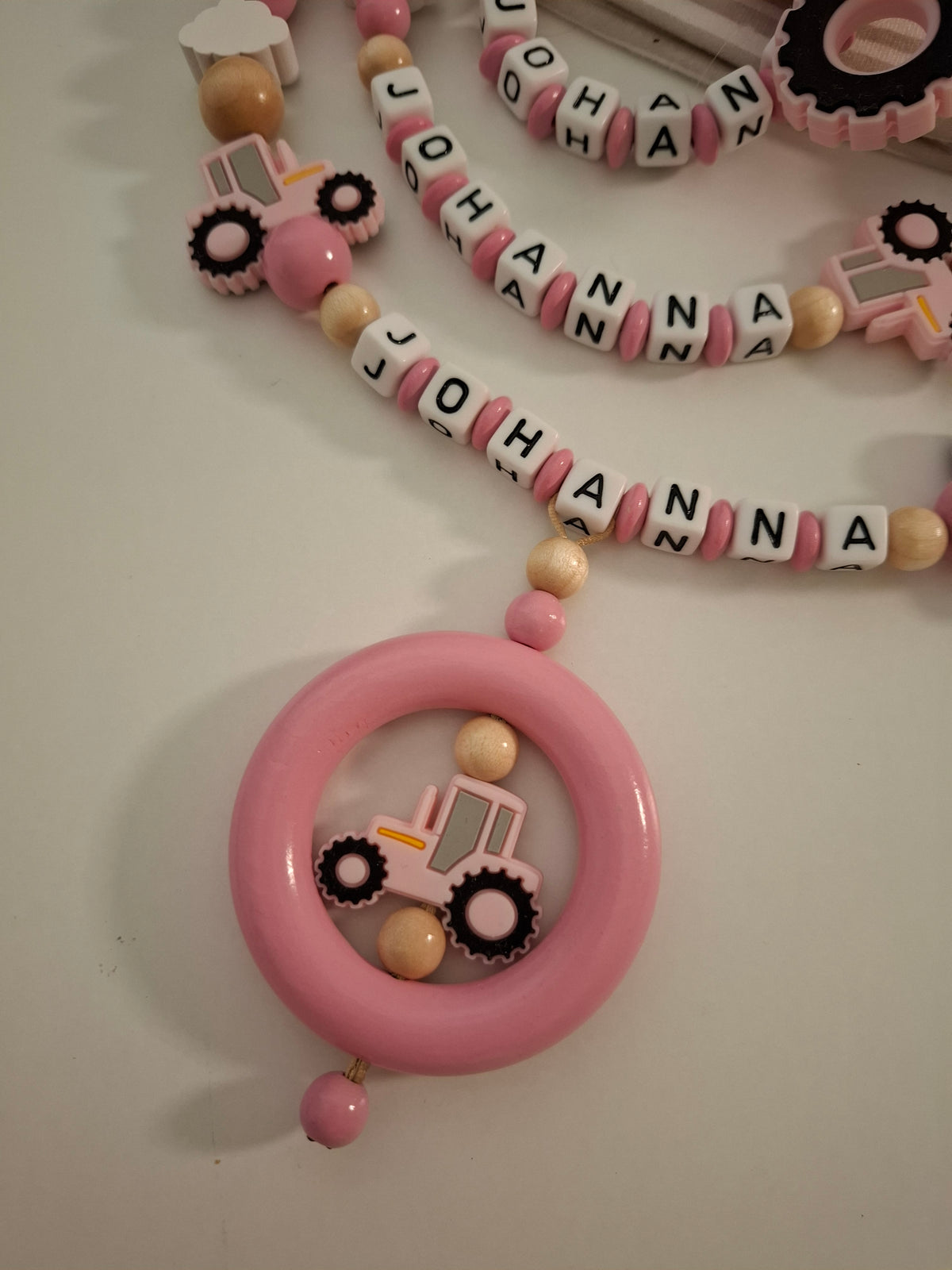 3er-Set Schnullerkette Kinderwagenkette & Greifring mit Namen Traktor rosa holz