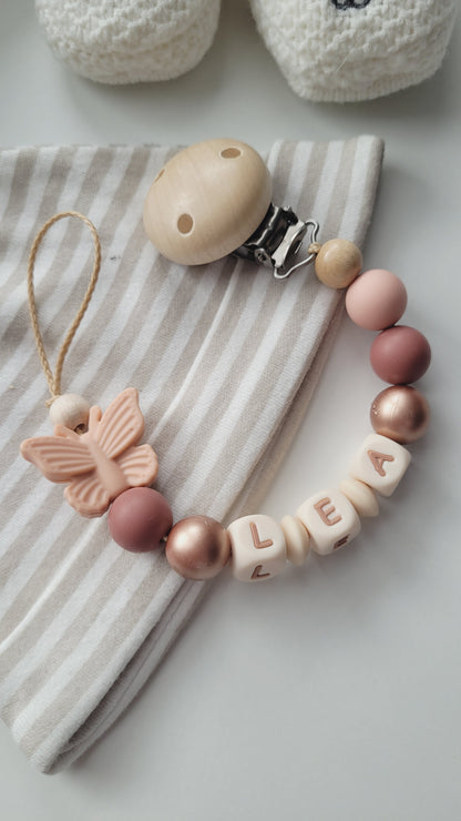 Schnullerkette mit Namen für Mädchen Schmetterling Pfirsich rotbraun rosegold