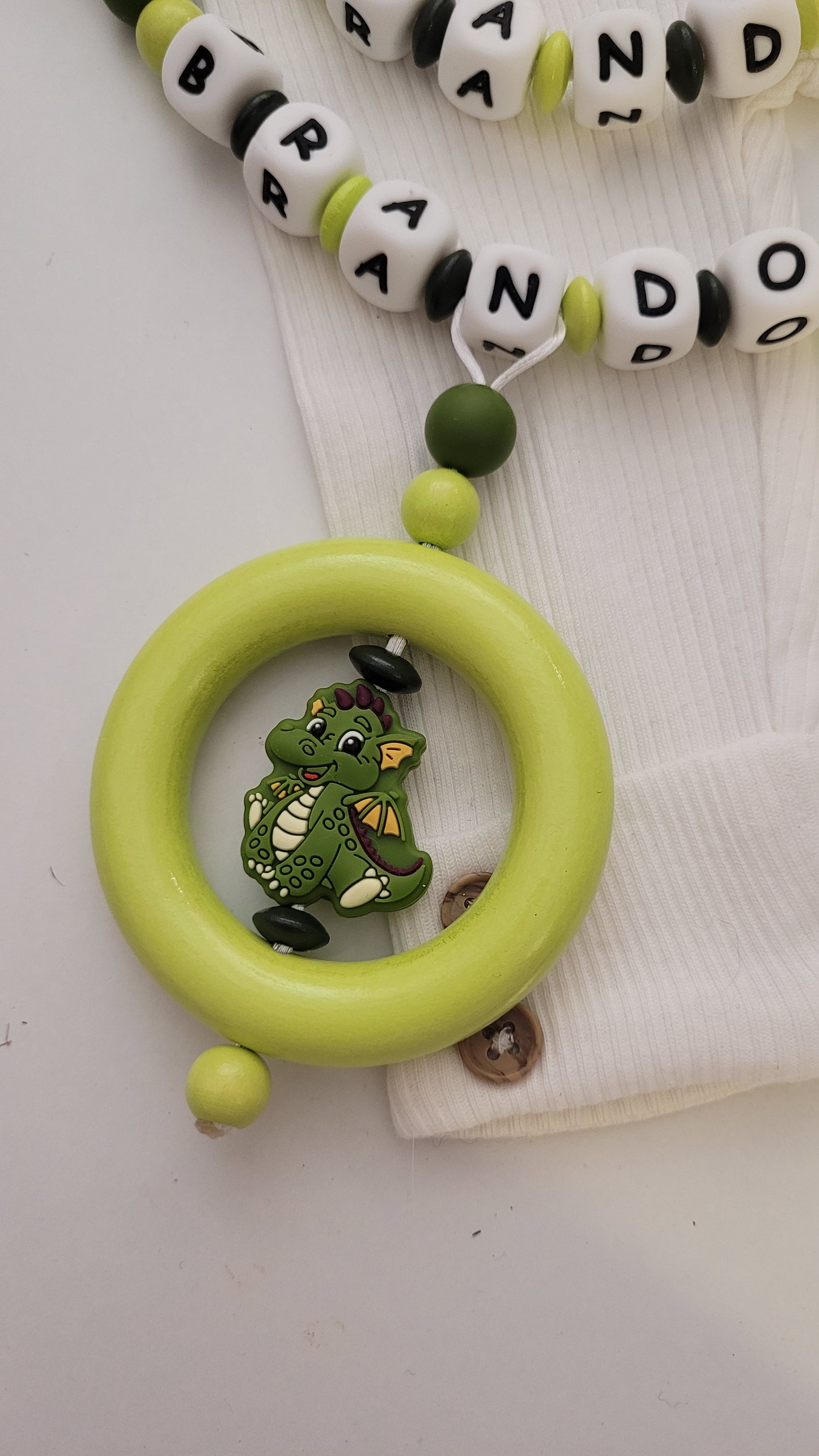 Kinderwagenkette & Schnullerkette mit Namen Drache grün