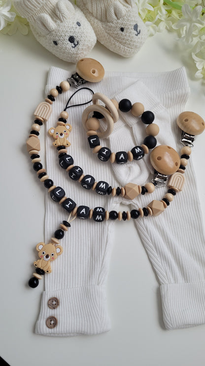 3 tlg Set Schnullerkette Kinderwagenkette Greifring Koalabärchen  Schwarz beige