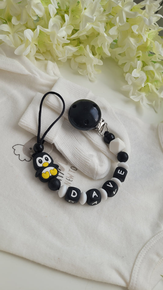Schnullerkette mit Namen für Jungen Pinguin schwarz & weiß