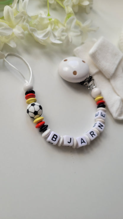 Schnullerkette mit Namen Fussball schwarz rot gelb