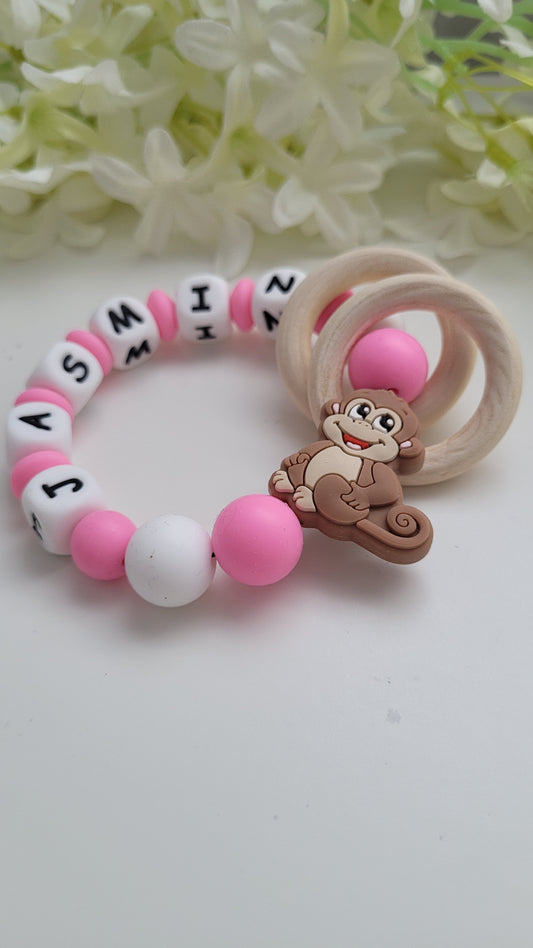 Motorik Greifring mit Namen Affe pink