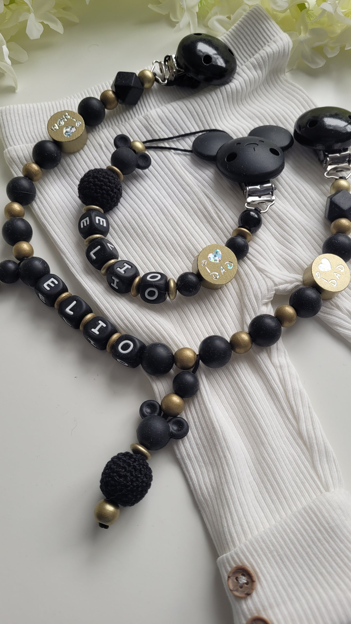 Kinderwagenkette & Schnullerkette mit Namen schwarz gold