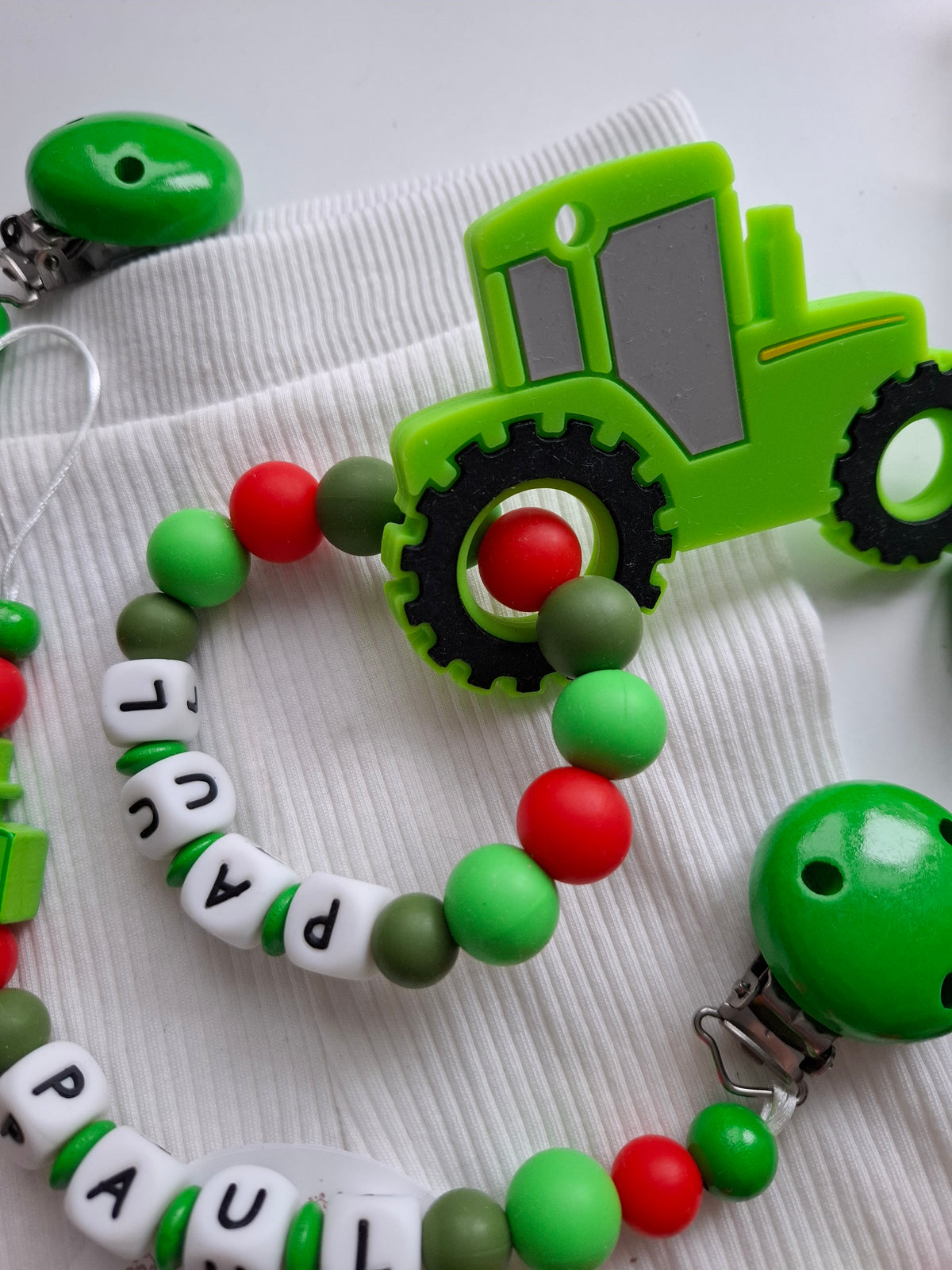 3er Set Schnullerkette Kinderwagenkette & Greifring mit Namen Traktor grün rot