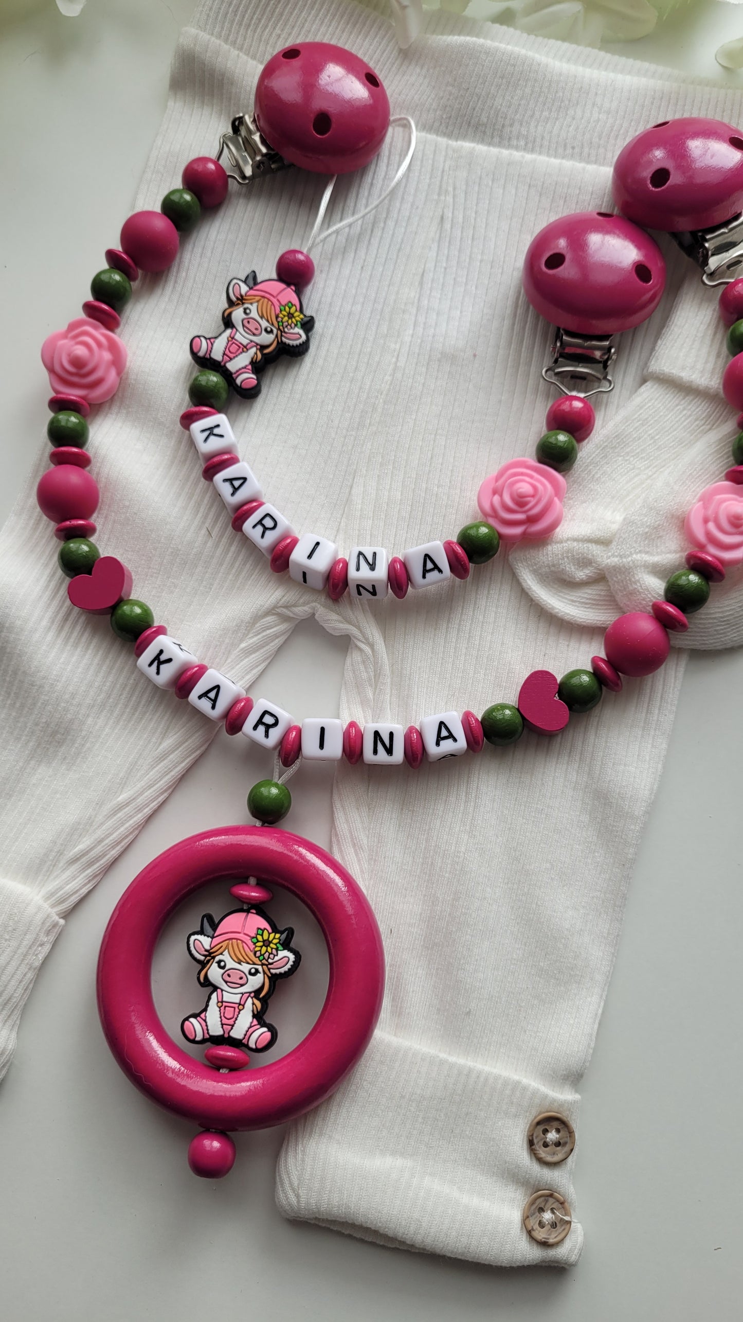Kinderwagenkette & Schnullerkette mit Namen Kuh pink grün