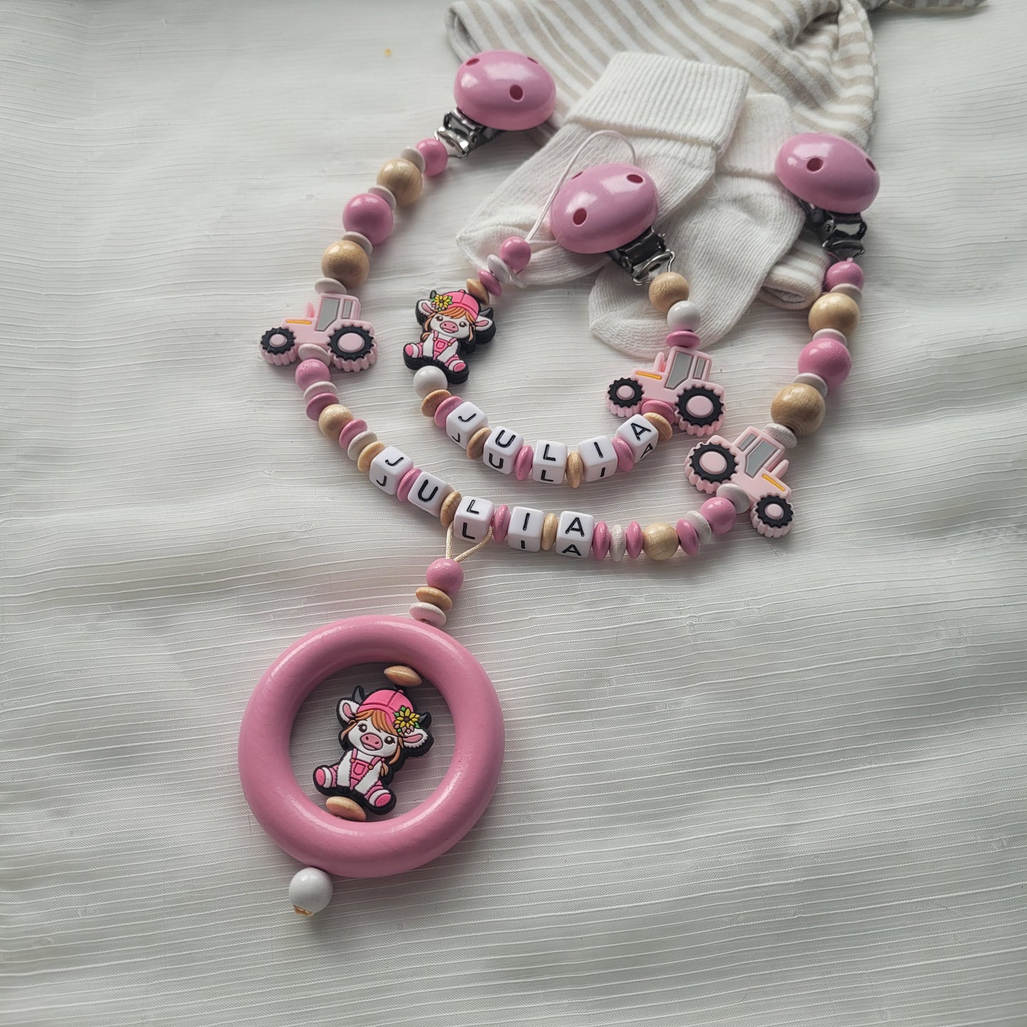 Kinderwagenkette & Schnullerkette mit Namen  Bauernhof Traktor & Kuh rosa holz