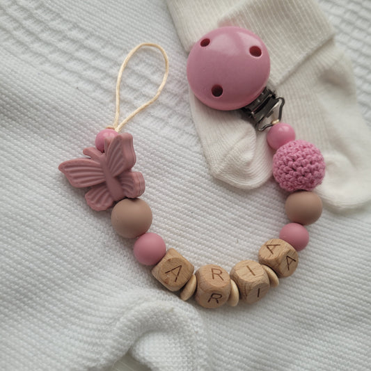 Schnullerkette mit Namen für Mädchen Schmetterling rosa beige