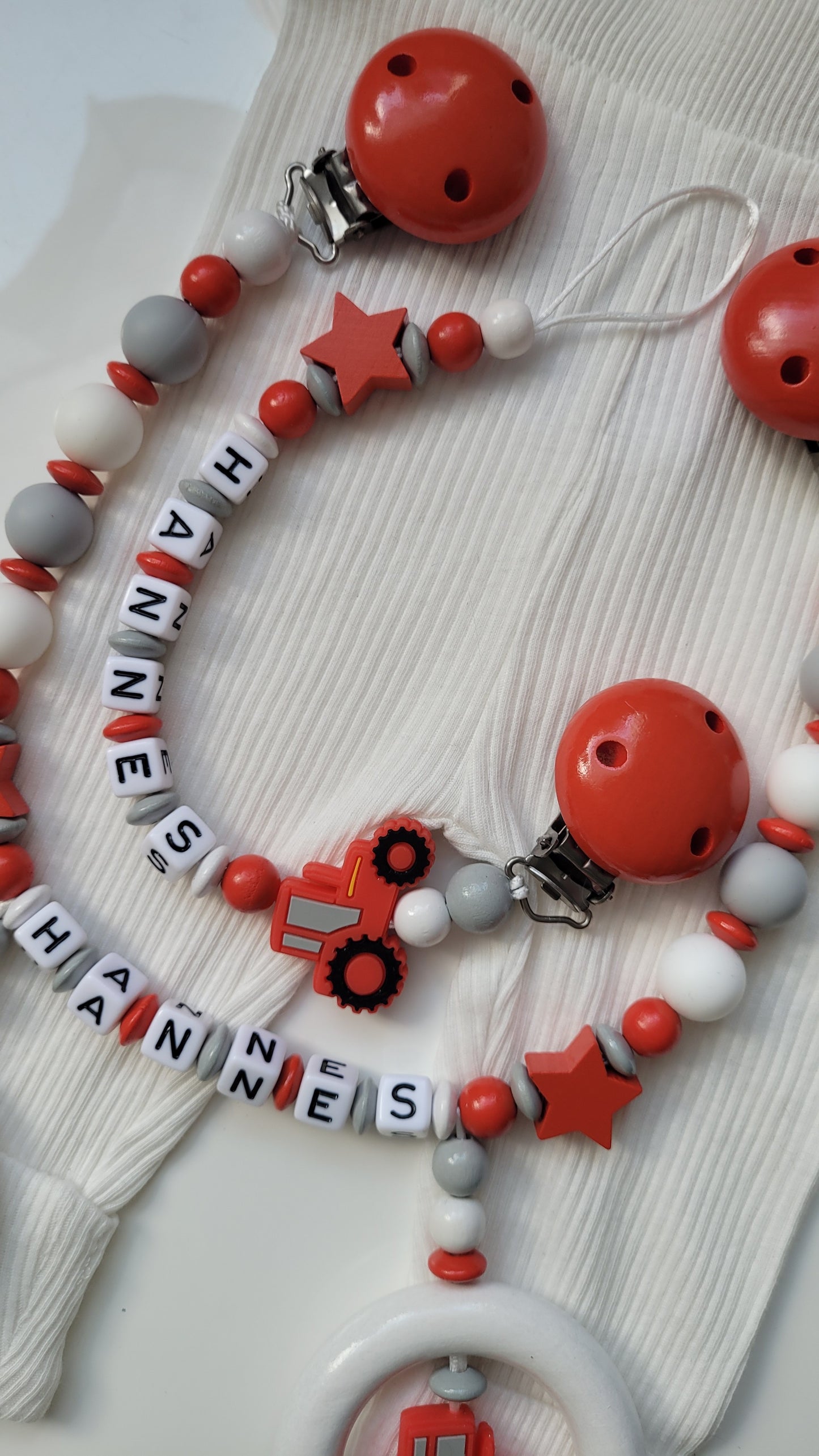 Kinderwagenkette & Schnullerkette *Traktor* rot