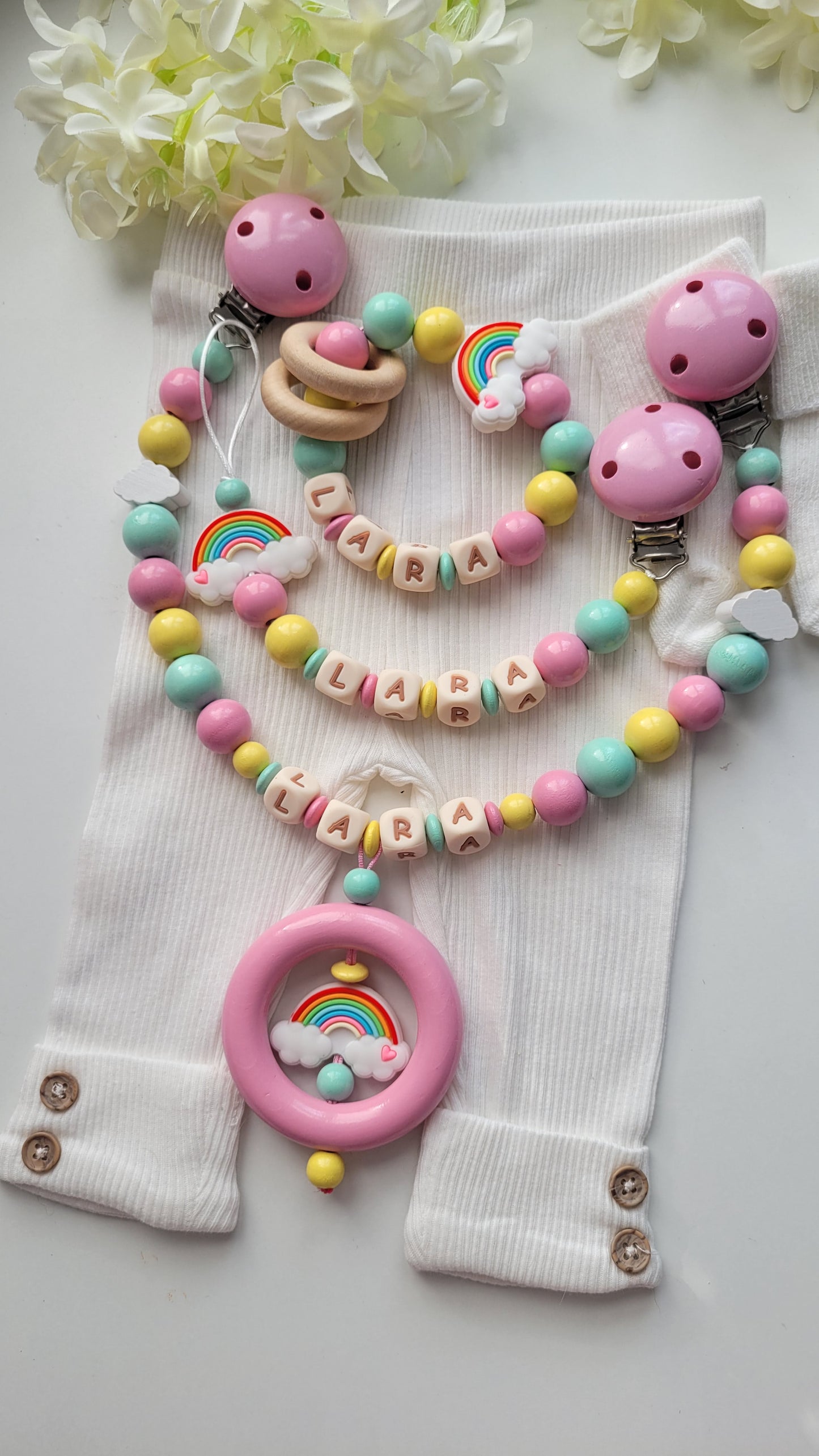 3er Set Schnullerkette, Kinderwagenkette & Greifring Regenbogen Pastellfarben